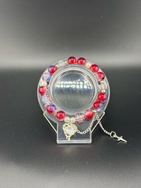 Handmade Red and Iridescent Beaded Bracelet with Silver Charm